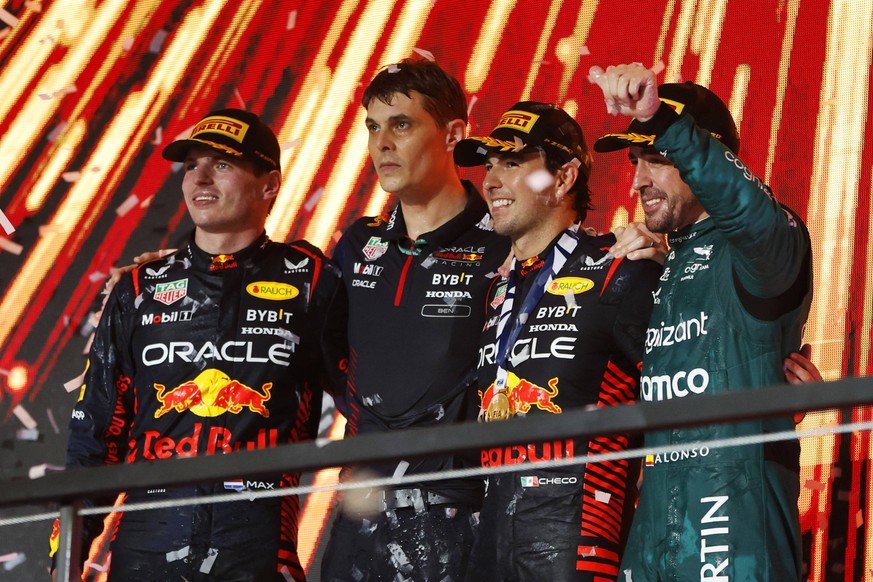 Formula 1 2023: Saudi Arabian GP JEDDAH STREET CIRCUIT, SAUDI ARABIA - MARCH 19: Max Verstappen, Red Bull Racing, 2nd position, the Red Bull trophy delegate, Sergio Perez, Red Bull Racing, 1st positio ...