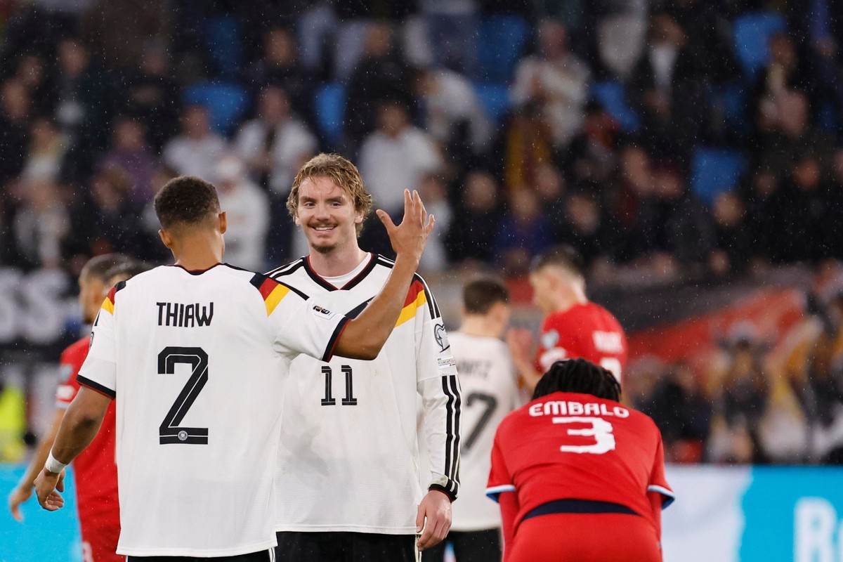 Germany&#039;s Nick Woltemade, center, and Germany&#039;s Malick Thiaw, left, celebrate their win during the 2026 World Cup group A qualifying soccer match between Luxembourg and Germany in Luxembourg ...