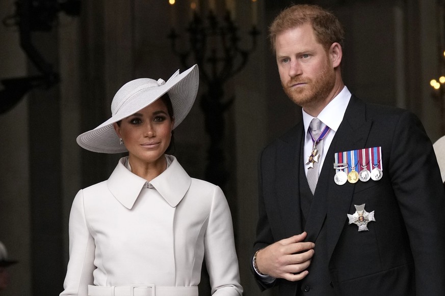 FILE - Prince Harry and Meghan Markle, Duke and Duchess of Sussex leave after a service of thanksgiving for the reign of Queen Elizabeth II at St Paul&#039;s Cathedral in London, Friday, June 3, 2022. ...