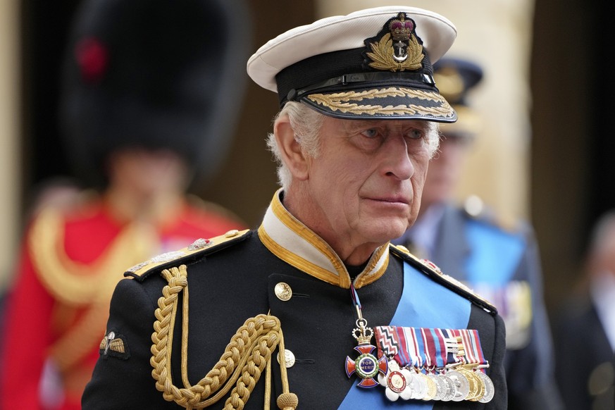 King Charles III follows the hearse with the coffin of Queen Elizabeth II moving towards St. George&#039;s Chapel at the Windsor Castle, in Windsor, England, Monday Sept. 19, 2022. The Queen, who died ...