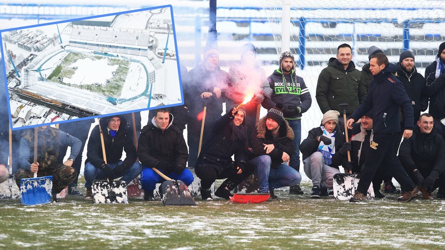 Fans clean snow at the stadium 16.12.2018., Osijek - The Kohorta supporters and employees of NK Osijek cleaned the football field from the snow so that a delayed match could be played today. PUBLICATI ...