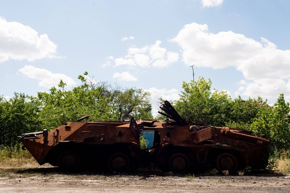 Ukraine Faces Off With Russia In Kherson Oblast, Whose Capital Fell Early In War A destroyed Russian Armoured Personnel Carrier lies rusting on the roadside in the village of Bilozirka in Mykolaiv, Uk ...