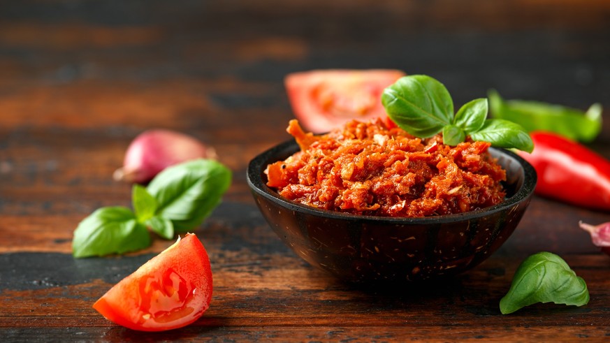 Sun dried tomato pesto with chilli, garlic and herbs in bowl. xkwx background, food, vintage, sun, leaf, pesto, red, tomato, italian, vegetarian, vegetable, sauce, healthy, ingredient, dried, garlic,  ...