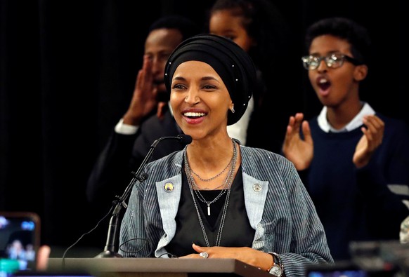 Democratic congressional candidate Ilhan Omar reacts after appearing at her midterm election night party in Minneapolis, Minnesota, U.S. November 6, 2018. REUTERS/Eric Miller