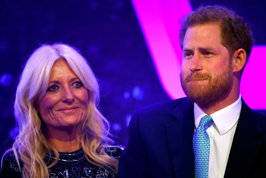 LONDON, ENGLAND - OCTOBER 15: Prince Harry, Duke of Sussex reacts next to television presenter Gaby Roslin as he delivers a speech during the WellChild Awards at Royal Lancaster Hotel on October 15, 2 ...