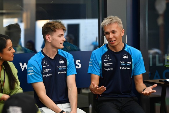 Formula 1 2023: Saudi Arabian GP JEDDAH STREET CIRCUIT, SAUDI ARABIA - MARCH 16: Logan Sargeant, Williams Racing, with Alex Albon, Williams Racing, speak to guests during the Saudi Arabian GP at Jedda ...