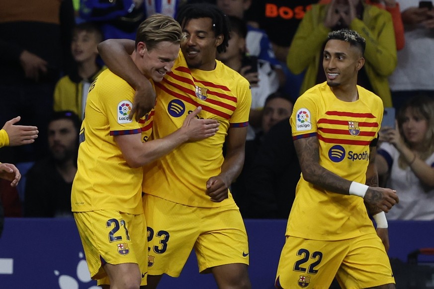 Barcelona&#039;s Jules Kounde, centre, celebrates after scoring his side&#039;s fourth goal during the Spanish La Liga soccer match between Espanyol and Barcelona at the RCDE stadium in Barcelona, Sun ...