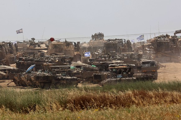 240509 -- KIBBUTZ REIM, May 9, 2024 -- Israeli armored vehicles are deployed near Kibbutz Reim in southern Israel, on May 9, 2024. The Israeli army will continue its operation in the southern Gaza Str ...