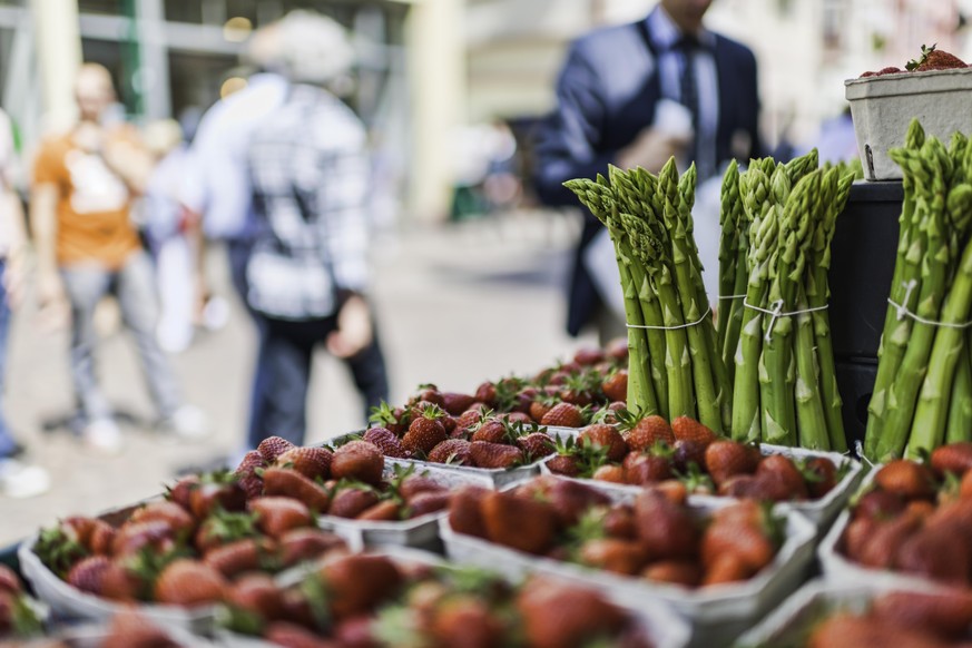 Sale of strawberries and asparagus on the street in Heidelberg, Germany.