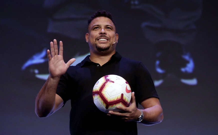 FILE - Former Brazilian soccer star Ronaldo Luis Nazario waves to the crowd before a World Football Summit conference, in Madrid, Spain, Sept. 25, 2018. Less than year after Ronaldo got involved with  ...