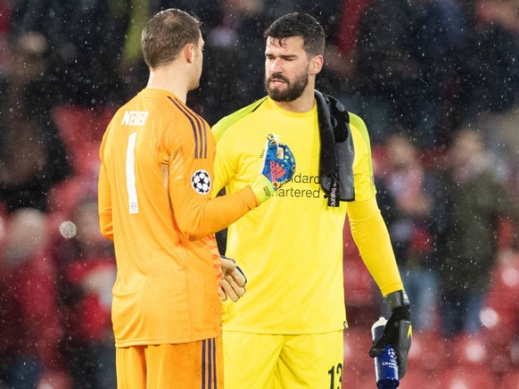 goalkeeper Manuel Neuer of FC Bayern Munchen, goalkeeper Alisson Becker of Liverpool FC during the UEFA Champions League round of 16 match between Liverpool FC and Bayern Munich at Anfield on February ...