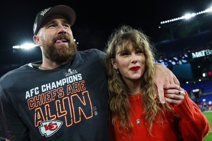 BALTIMORE, MARYLAND - JANUARY 28: Travis Kelce #87 of the Kansas City Chiefs (L) celebrates with Taylor Swift after defeating the Baltimore Ravens in the AFC Championship Game at M&amp;T Bank Stadium  ...