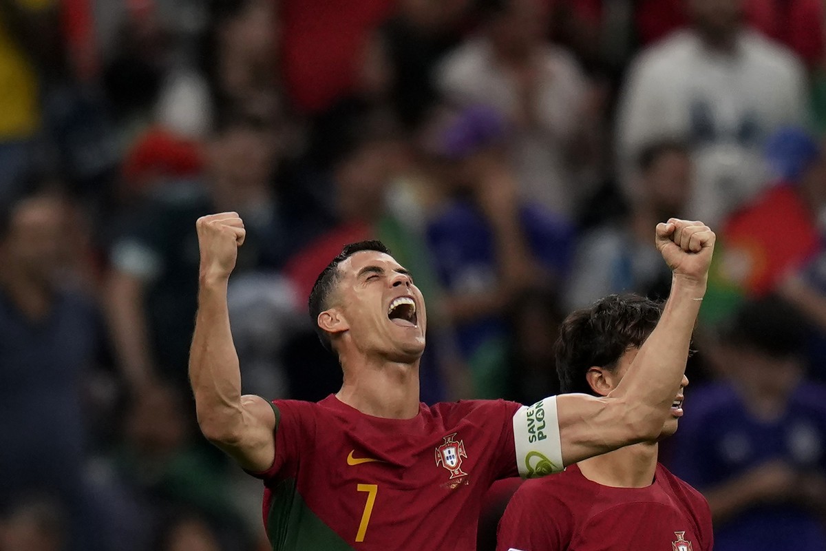 Portugal&#039;s Cristiano Ronaldo celebrates after scoring his side&#039;s opening goal during the World Cup group H soccer match between Portugal and Uruguay, at the Lusail Stadium in Lusail, Qatar,  ...