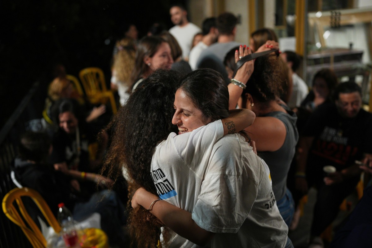 Relatives and supporters of Israeli hostages held by Hamas in the Gaza Strip celebrate after the announcement that Israel and Hamas have agreed to the first phase of a peace plan, as they gather at a  ...