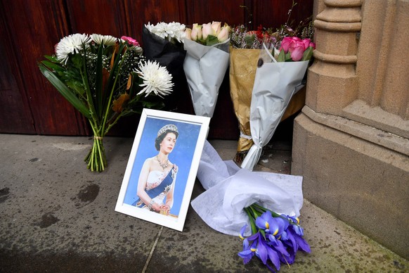 QUEEN ELIZABETH II AUSTRALIA REAX, Bunches of flowers and a photograph of Queen Elizabeth II are left at the entrance of St. Andrew s Cathedral in Sydney, Friday, September 9, 2022. Queen Elizabeth II ...