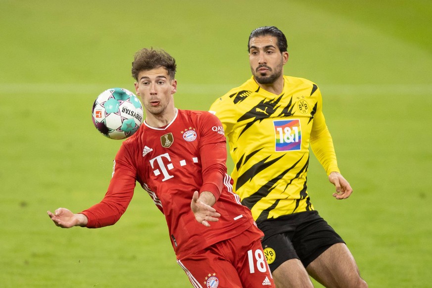 FC Bayern Muenchen vs. BV Borussia Dortmund - 1. Bundesliga Muenchen, Deutschland, 06.03.2021: Leon Goretzka FC Bayern Muenchen und Emre Can Borussia Dortmund im zweikampf bei dem Spiel der 1. Bundesl ...