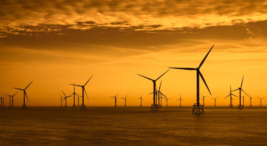 Wind turbines of the Thorntonbank Wind Farm, offshore windfarm off the Belgian coast in the North Sea at sunset. (Photo by: ARTERRA/Universal Images Group via Getty Images)