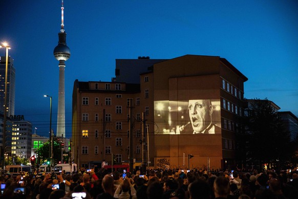 April 25, 2019 - Berlin, Berlin, Germany - A projection of a video clip of the German rock band Rammstein is seen on a building side in Berlin, Germany, April 25, 2019. The group will release their ne ...
