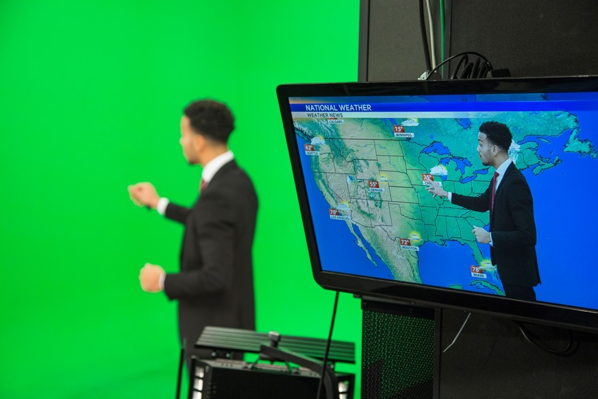 Weather presenter explaining about weather forecast.