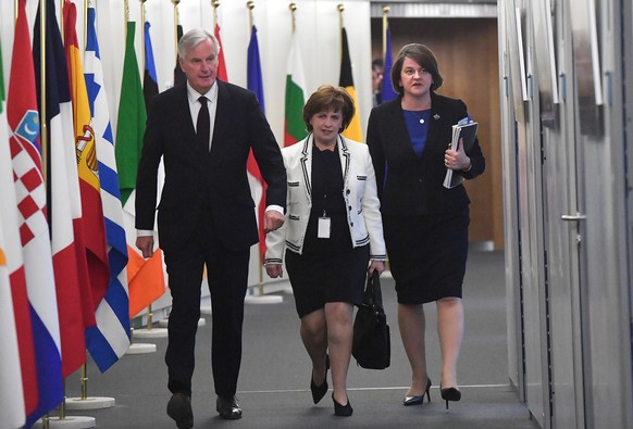 European Union&#039;s chief Brexit negotiator Michel Barnier walks with Northern Ireland&#039;s Democratic Unionist Party (DUP) leader Arlene Foster and DUP member Diane Dodds prior to a meeting at th ...