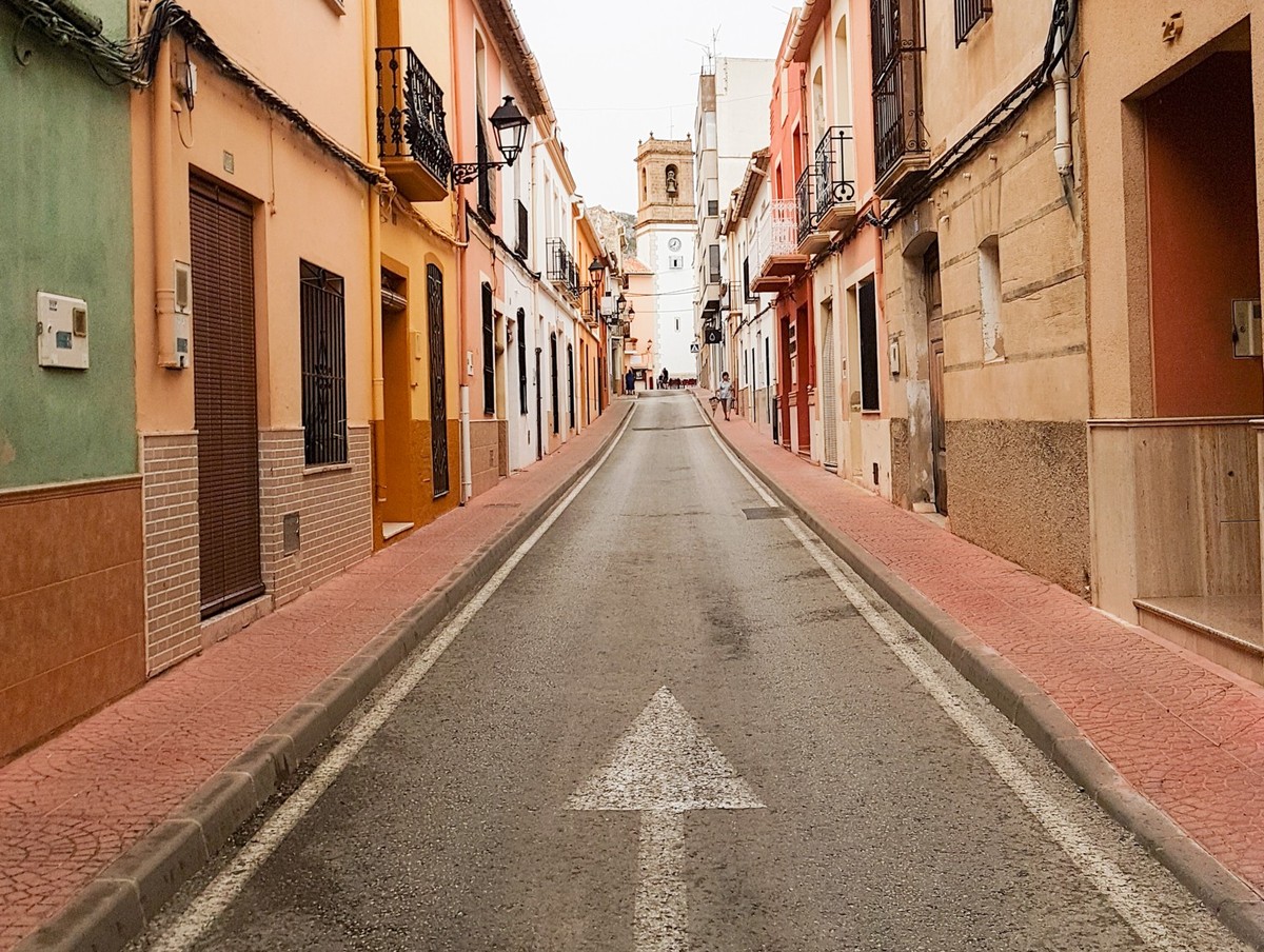 Orba Spain - August 16 2016; typically narrow and picturesque European village street lined by two level buildings xkwx Costa Blanca, Orba, Orba street, People, Spain, architecture, building, building ...