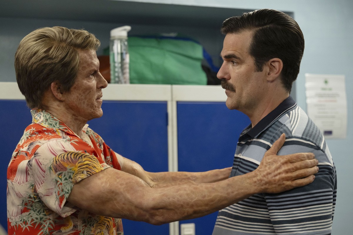 This image released by 20th Century Studios/Marvel Studios shows Ryan Reynolds as Deadpool/Wade Wilson left, and Rob Delaney as Peter in a scene from "Deadpool & Wolverine." (20th Centur ...