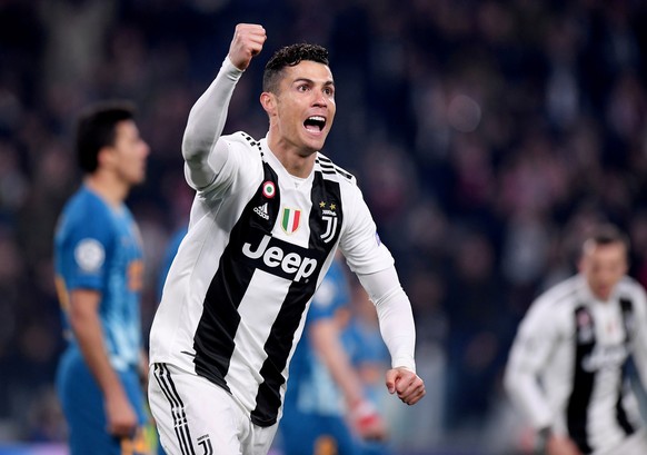 FILE PHOTO: Soccer Football - Champions League - Round of 16 Second Leg - Juventus v Atletico Madrid - Allianz Stadium, Turin, Italy - March 12, 2019 Juventus&#039; Cristiano Ronaldo celebrates scorin ...