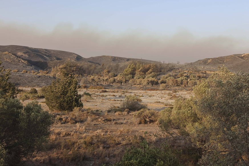 Wildfires Continue To Rage In Rhodes Wildfires in the Greek island of Rhodes, on July 26, 2023. Greece is currently grappling with rampant wildfires fueled by sweltering heat, leading to extensive eva ...