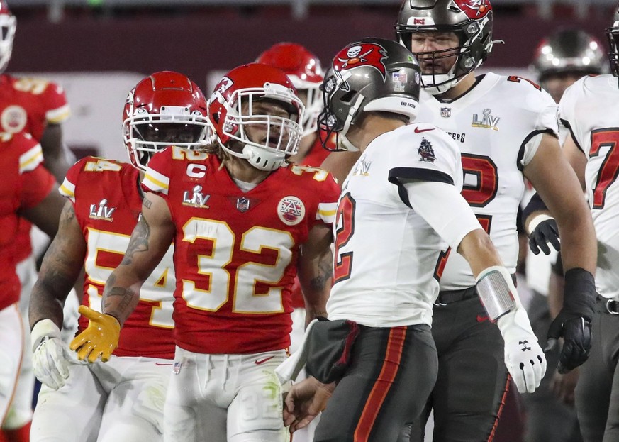 February 7, 2021, Tampa, Florida, USA: Tampa Bay Buccaneers quarterback Tom Brady 12, right, has words with Kansas City Chiefs strong safety Tyrann Mathieu 32 during the final seconds of the second qu ...