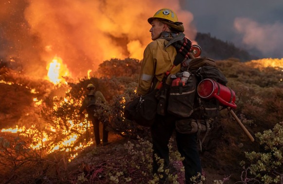 CALDOR, CALIFORNIA, UNITED STATES - 2021/08/23: Californias Caldor fire moves east toward Lake Tahoe as firefighters continue to battle a blaze that has grown to more than 170 square miles with only 5 ...
