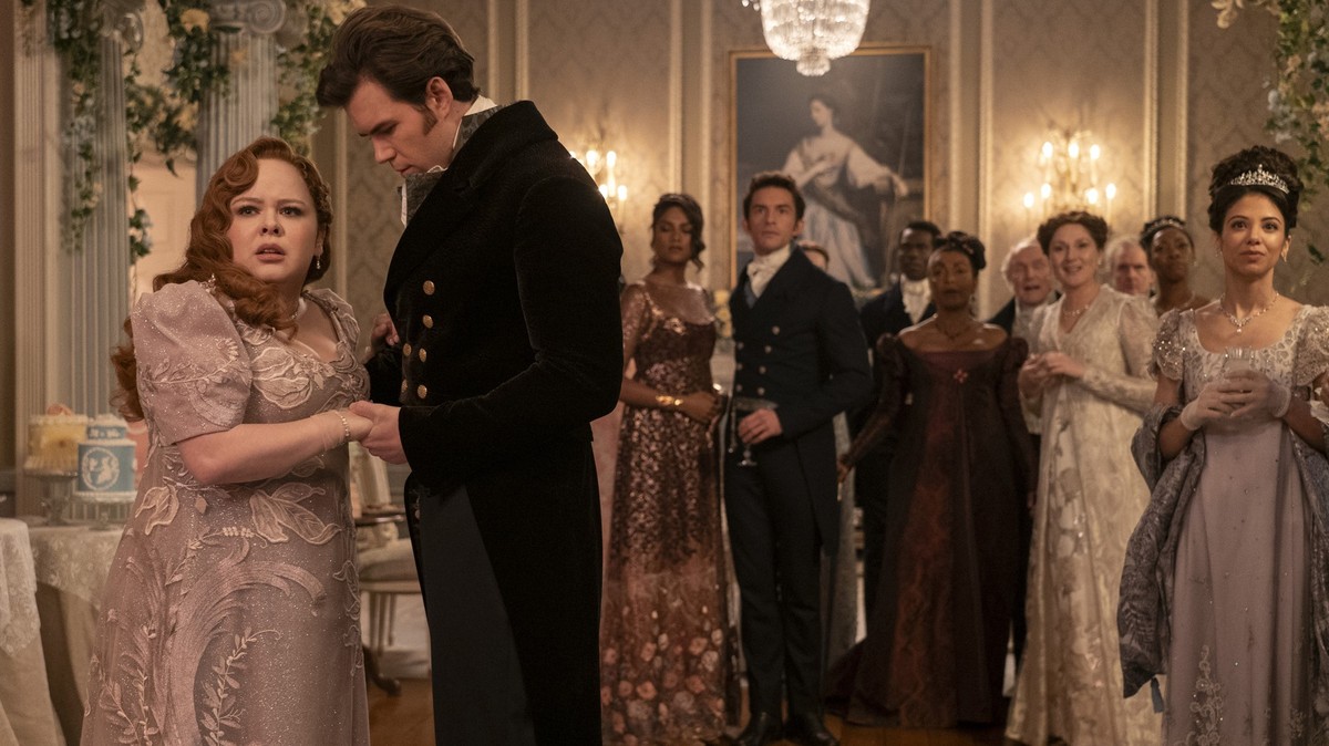Bridgerton. (L to R) Nicola Coughlan as Penelope Featherington, Simone Ashley as Kate Sharma, Jonathan Bailey as Anthony Bridgerton, Victor Alli as John Stirling, Adjoa Andoh as Lady Agatha Danbury, R ...