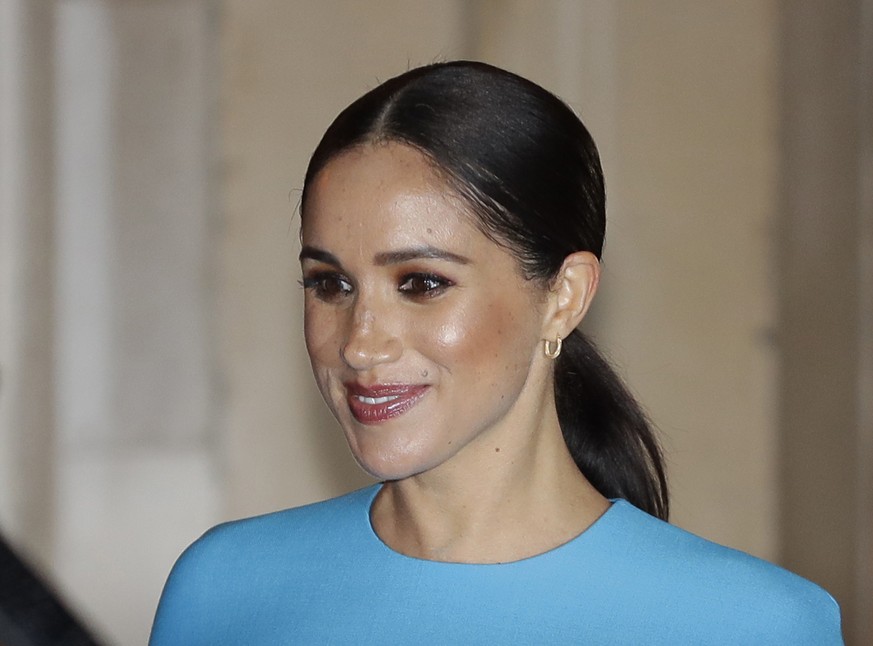 FILE - In this file photo dated Thursday, March 5, 2020, Britain&#039;s Meghan, the Duchess of Sussex leaves after attending the annual Endeavour Fund Awards in London. A British newspaper publisher o ...