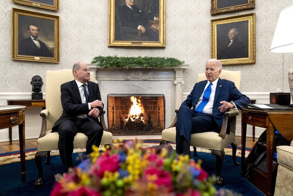 President Joe Biden, right, meets with German Chancellor Olaf Scholz in the Oval Office of the White House, Friday, Feb. 9, 2024, in Washington. (AP Photo/Andrew Harnik)