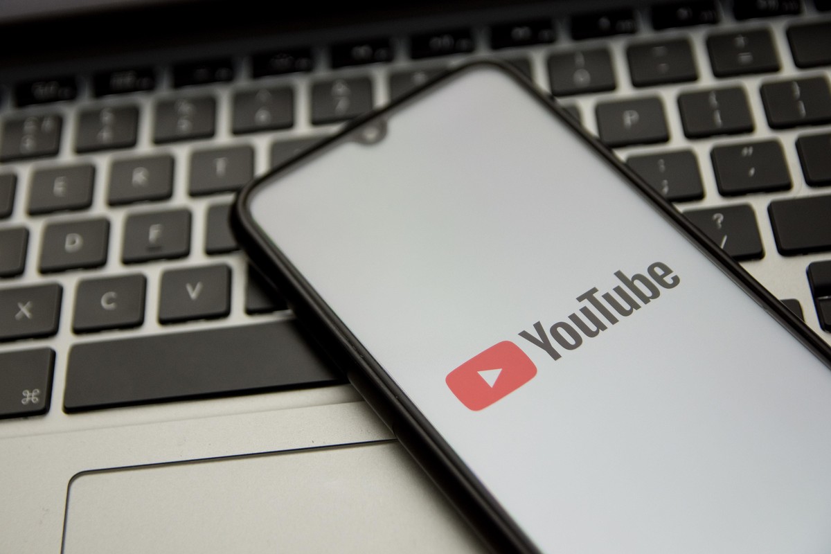 In this photo illustration an Youtube logo seen displayed on a smartphone screen with a computer keyword in the background in Athens, Greece on November 18, 2021. (Photo by Nikolas Kokovlis/NurPhoto)