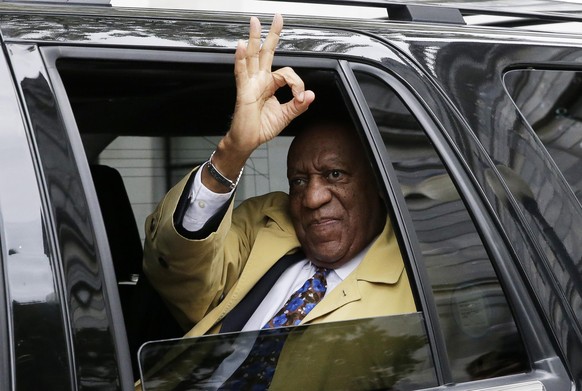 Bill Cosby gives the OK sign as his car pulls away from Montgomery County Courthouse in Norristown, Pennsylvania, after closing arguments in his sexual assault trial on April 24, 2018. Closing argumen ...