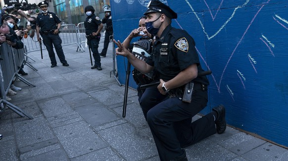 Protest held to denounce killing of George Floyd of Minneapolis on the streets of Manhattan during COVID-19 pandemic. Several thousand of peaceful protesters gather on Times Square where police office ...