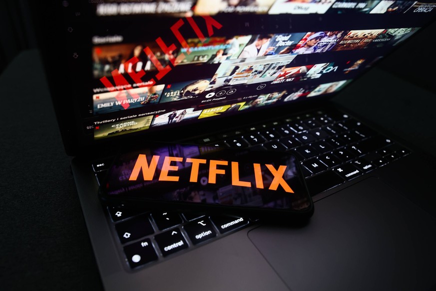 Popular Streaming Services Photo Illustrations Netflix logo displayed on a phone screen and Netflix website displayed on a laptop screen are seen in this illustration photo taken in Krakow, Poland on  ...