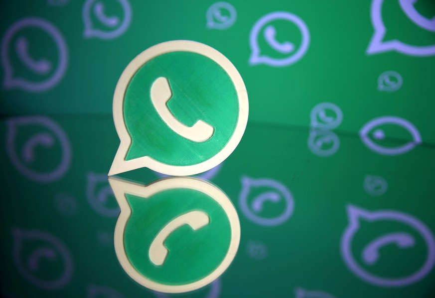 FILE PHOTO: A 3D printed Whatsapp logo is seen in front of a displayed Whatsapp logo in this illustration September 14, 2017. REUTERS/Dado Ruvic/File Photo