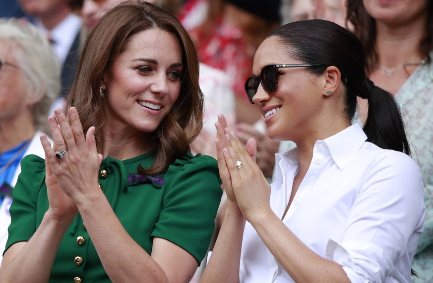 Kate Middleton (Duchess of Cambridge) and Meghan Markle (Duchess of Sussex), Pippa Middleton watch the Ladies Singles Final between Serena Williams and Simona Halep at The Wimbledon Championships tenn ...