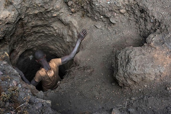 KAWAMA, DEMOCRATIC REPUBLIC OF CONGO - JUNE 8 A creuseur, or digger, descends into a copper and cobalt mine in Kawama, Democratic Republic of Congo on June 8, 2016. Cobalt is used in the batteries for ...
