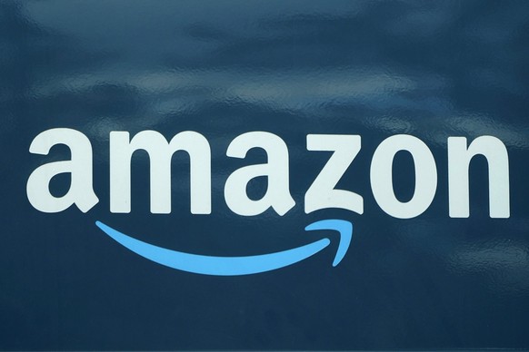 FILE - An Amazon logo appears on a delivery van, Oct. 1, 2020, in Boston. Amazon plans to eliminate 9,000 more jobs in the next few weeks, the company&#039;s CEO Andy Jassy said in a memo to staff on  ...