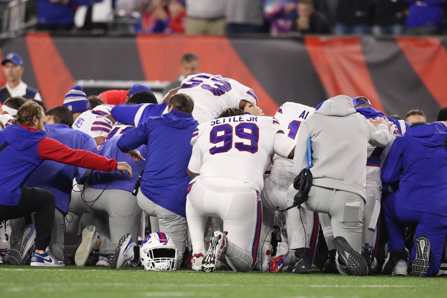 CINCINNATI, OH - JANUARY 02: The Buffalo Bills organization prays on the field after safety Damar Hamlin 3 was taken off the field in an ambulance during the game against the Buffalo Bills and the Cin ...