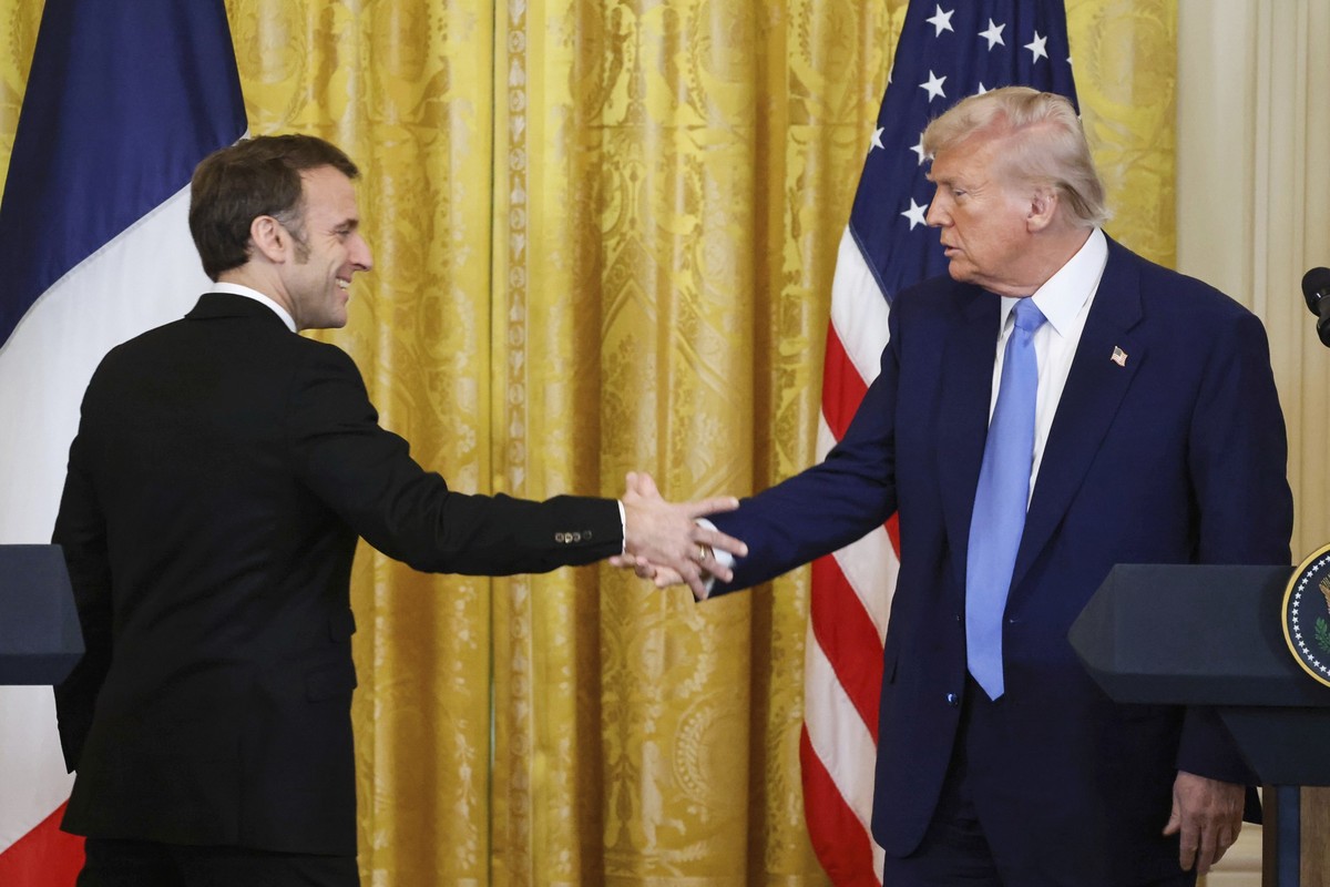 President Donald Trump, right, shakes the hand of France&#039;s President Emmanuel Macron during a joint press conference in the East Room of the White House in Washington, Monday, Feb. 24, 2025. (Lud ...