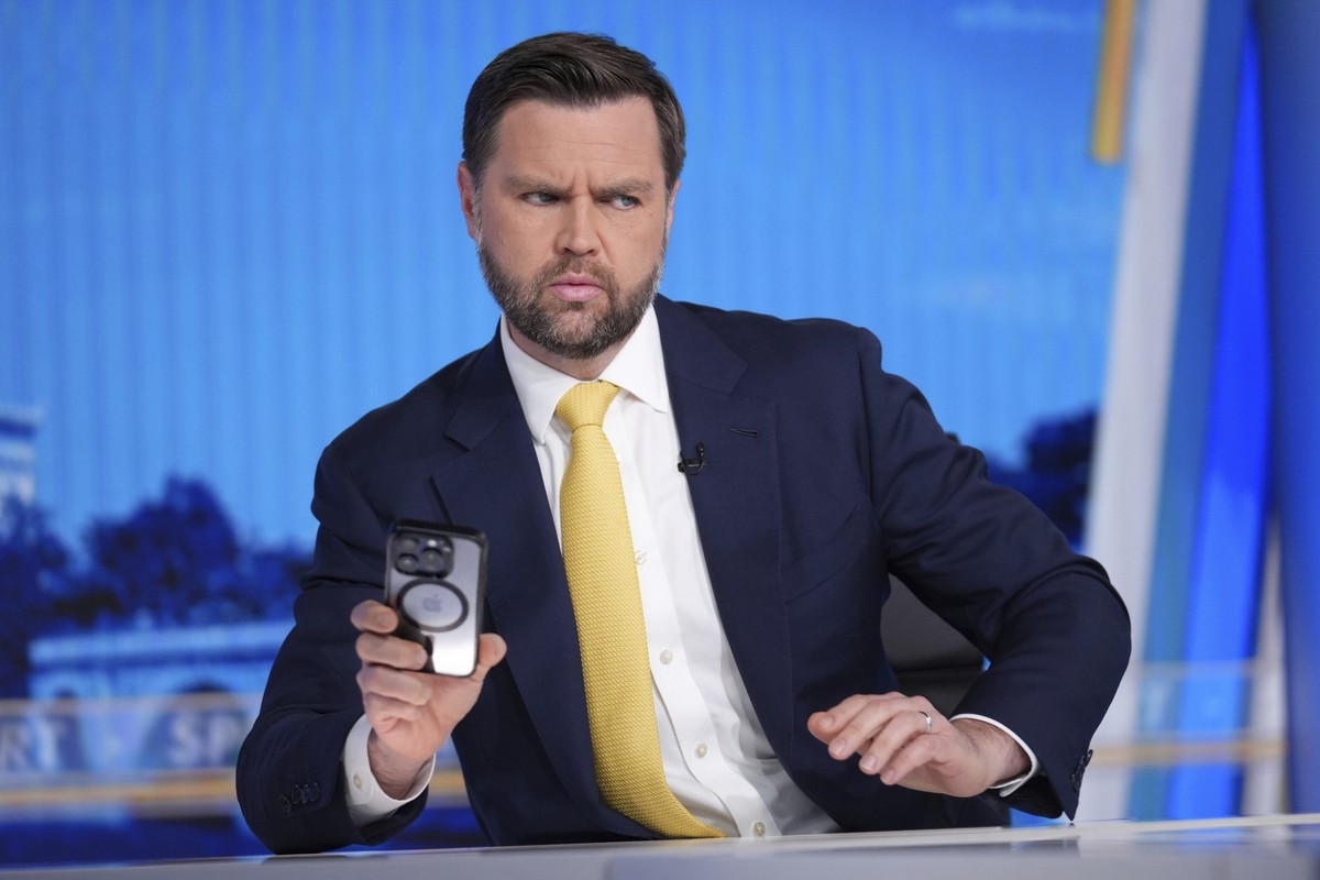 Vice President JD Vance checks his phone just before his interview with Bret Baier on FOX News Channel’s Special Report with Bret Baier at the FOX News bureau in Washington, Monday, June 23, 2025.(AP ...