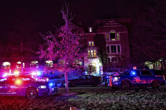 Police stage outside the Michigan State University Union off Abbot Road on Monday, Feb. 13, 2023, in East Lansing, Mich. Police urged frightened students and others to shelter in place as they searche ...