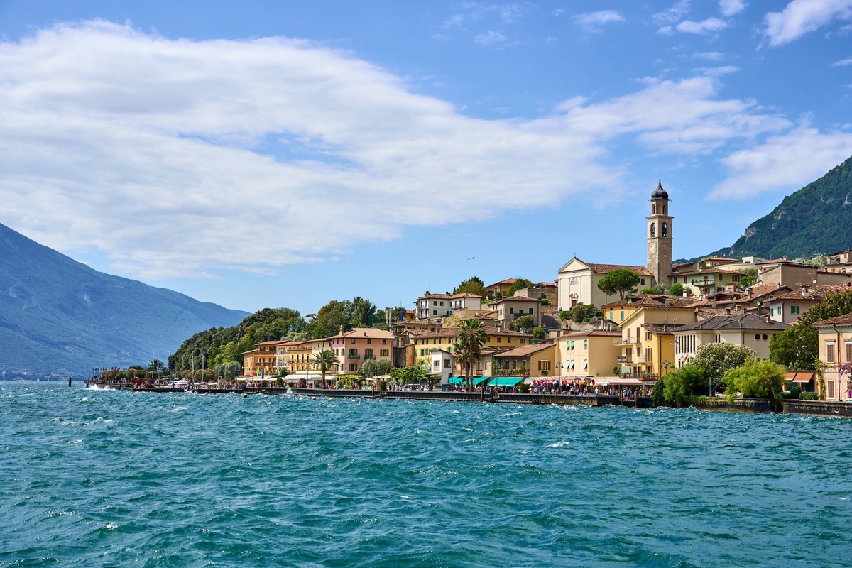 Limone Sul Garda, Lake Garda, Italy - July 20, 2024: Limone on Lake Garda impresses with its picturesque lakeside promenade, historic buildings and imposing mountain backdrop. A popular destination fo ...