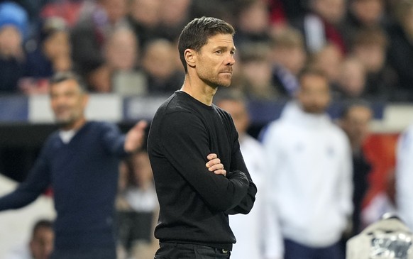 Leverkusen&#039;s head coach Xabi Alonso stands disappointed during the Champions League Group B soccer match between Bayer Leverkusen and FC Porto at the BayArena in Leverkusen, Germany, Wednesday, O ...