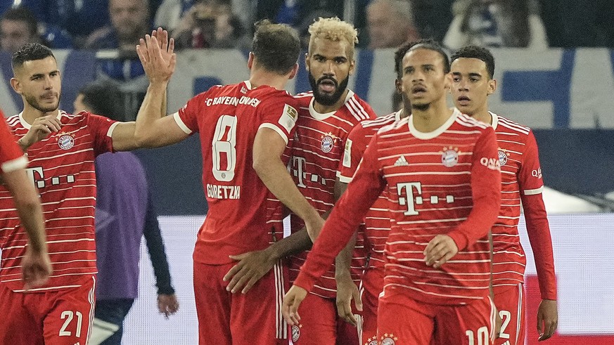 Bayern's Eric Maxim Choupo-Moting, center, celebrates his 2-0 goal with his team during the German Bundesliga soccer match between FC Schalke 04 and Bayern Munich in Gelsenkirchen, Germany, Saturday,  ...