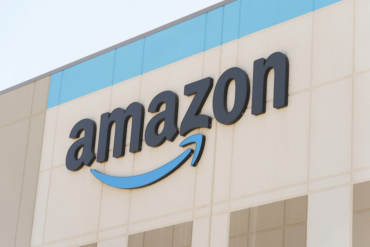 The Amazon logo is seen on the exterior wall of the Amazon OXR1 fulfillment center in Oxnard, Calif., on Wednesday, Aug. 21, 2024. (AP Photo/Damian Dovarganes)