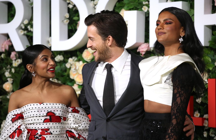 LONDON, ENGLAND - MARCH 22: (L-R) Charithra Chandran, Jonathan Bailey and Simone Ashley attend the &quot;Bridgerton&quot; Series 2 World Premiere at Tate Modern on March 22, 2022 in London, England. ( ...